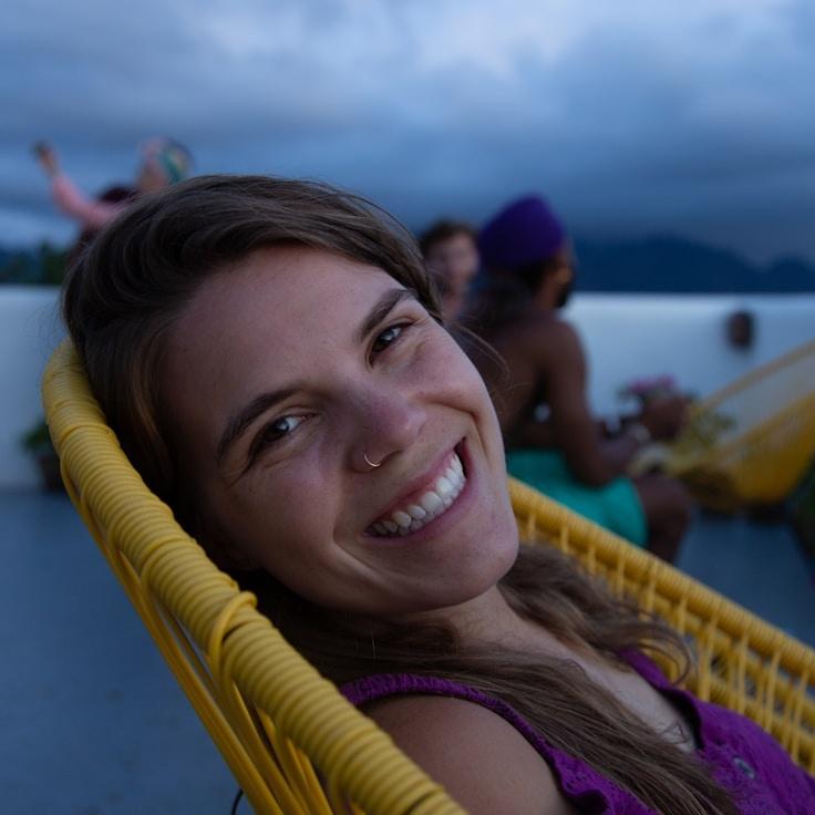 Kaveri Mehta, Lead Design Curator at FlexibleMindWay, reviewing corporate floral arrangements